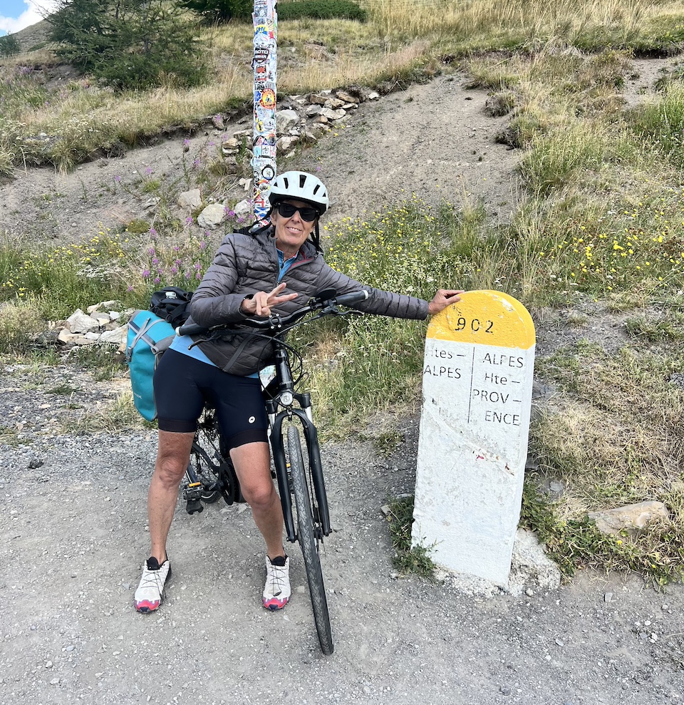 Pascale Chollet cycling in Vars on the Route des Grandes Alpes