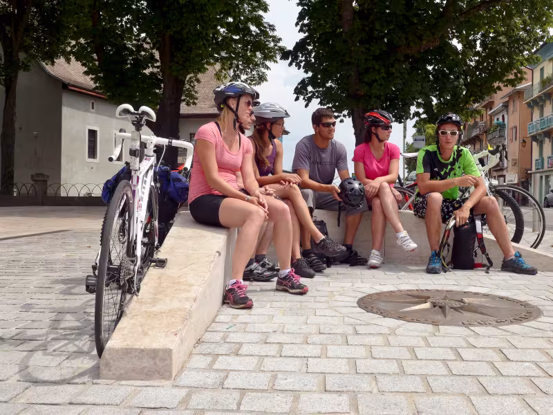 Group departing from Route des Grandes Alpes by bike