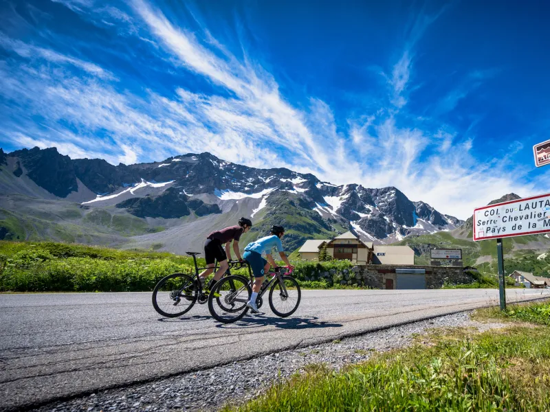 Cyclists on the Col du Lautaret on the Route des Grandes Alpes®.