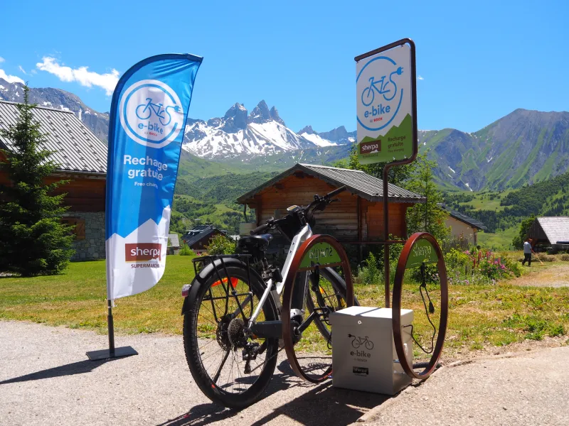 VAE recharging with a view of the Aiguilles d'Arves mountains