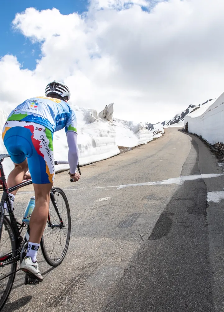Cycling in the snow on the Route des Grandes Alpes