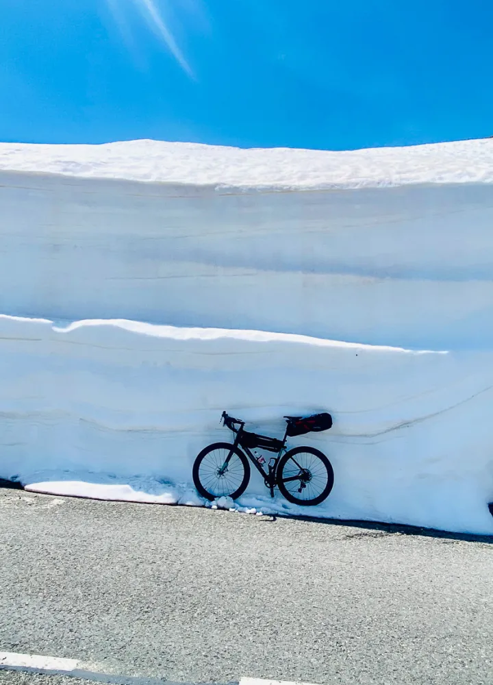 Cycling through snow drifts on the Col du Galibier