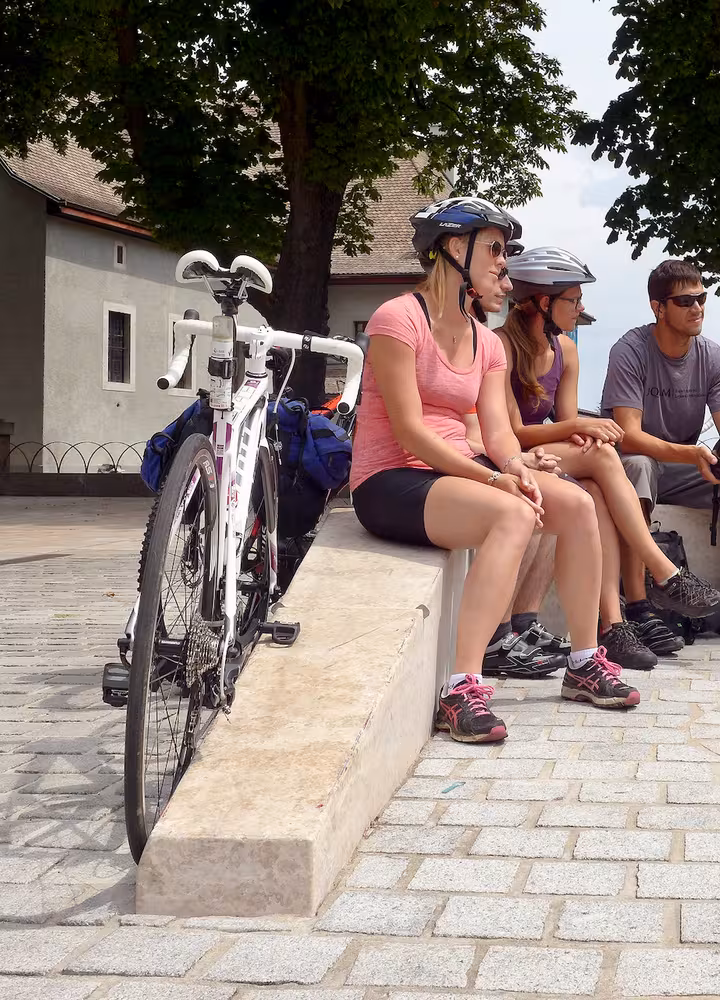 Group departing from Route des Grandes Alpes by bike
