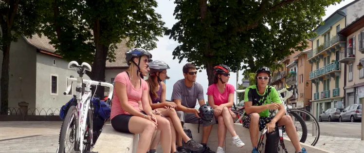 Group departing from Route des Grandes Alpes by bike