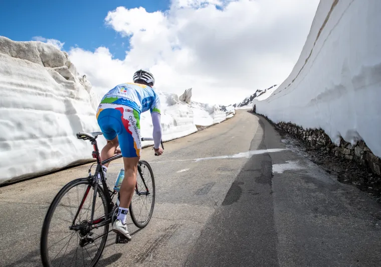 Cycling in the snow on the Route des Grandes Alpes