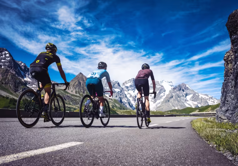 three cyclists on the Route des Grandes Alpes