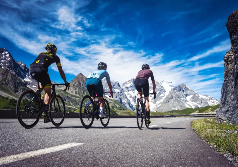 three cyclists on the Route des Grandes Alpes